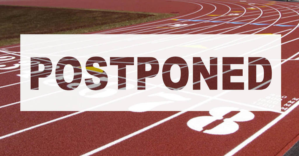 This is a picture of a red track with the words postponed superimposed over the track. 
